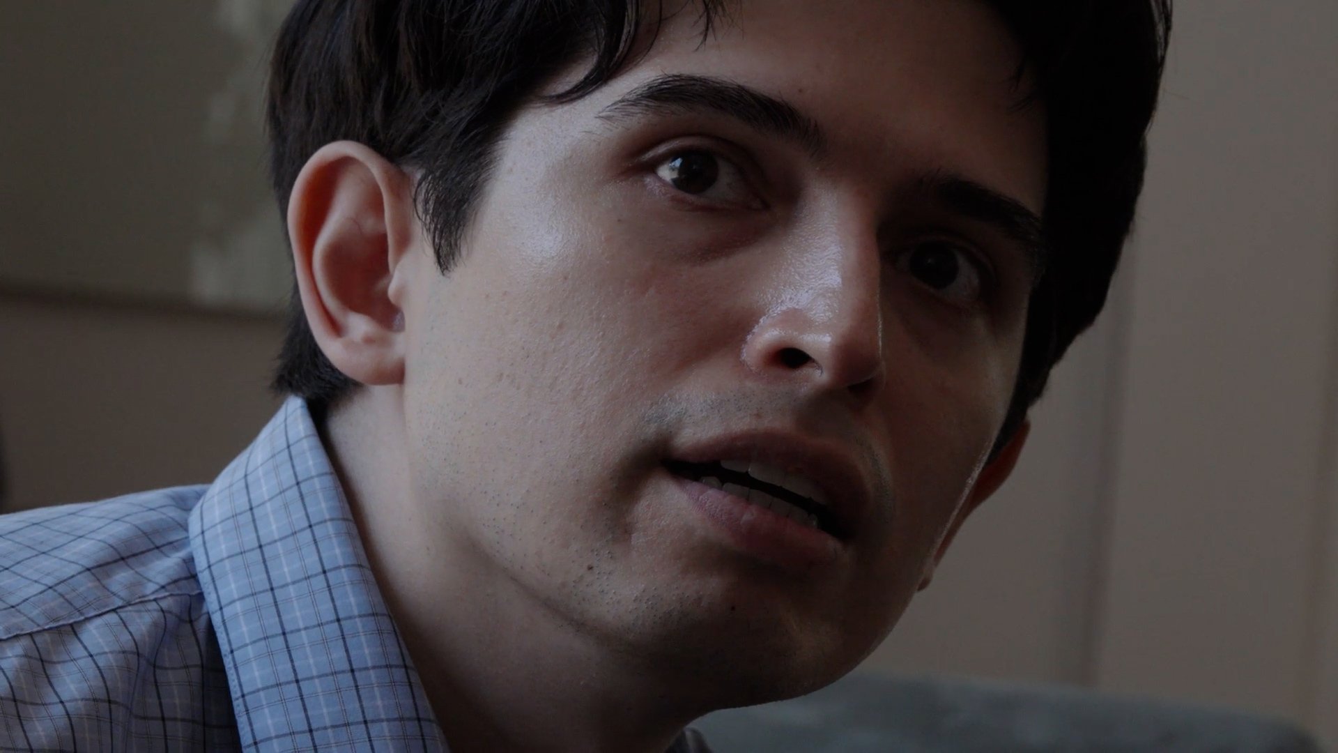 Close-up of a young man mid-sentence — still from Devin